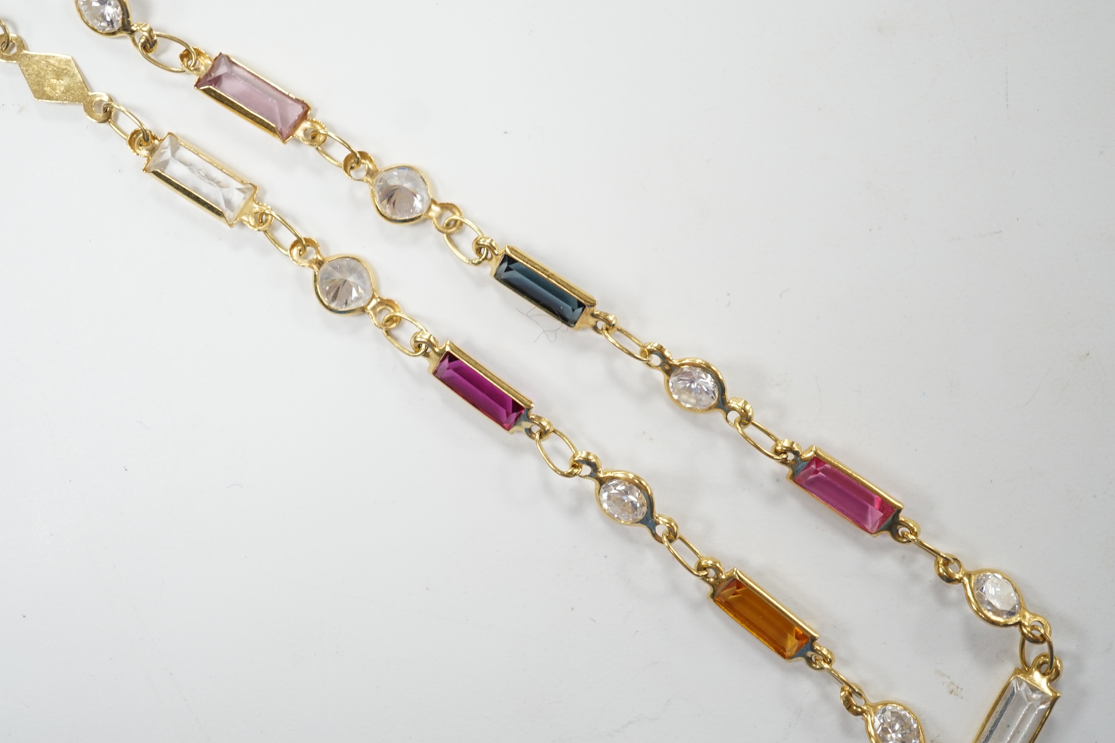 A modern 750 yellow metal and multi-gem set bracelet, 18.5cm, gross weight 2.7 grams. Fair condition
